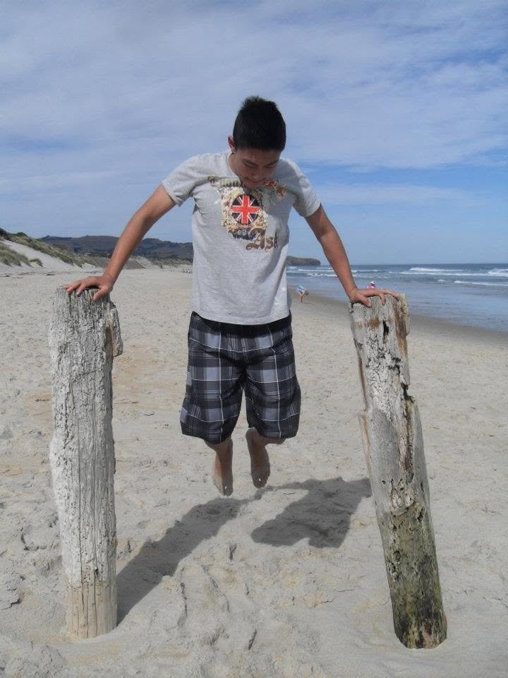 Josh doing a bodyweight dip at age 11